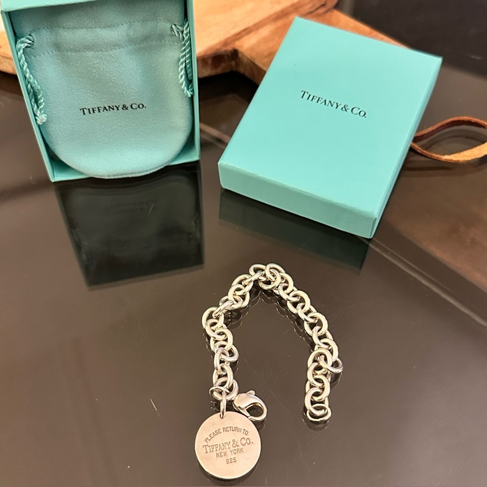 Please return to Tiffany & Co. Silver Link Bracelet with circle charm. Classic!